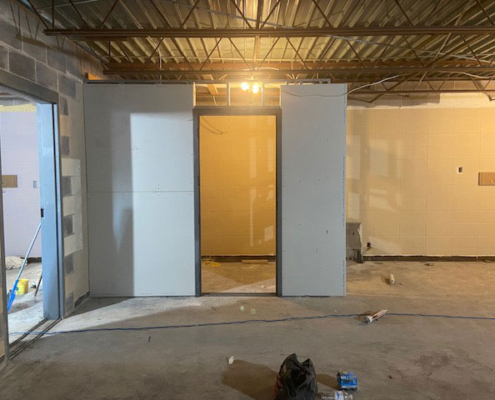 Sheetrock installed on the new restroom in the beginners class room