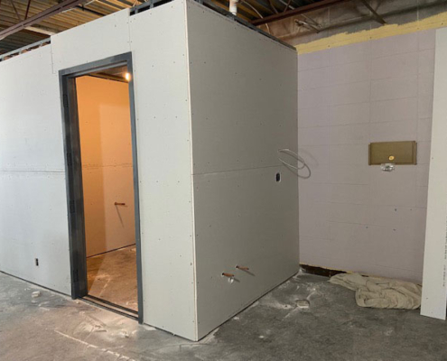 New restroom and storage closet sheetrock installed